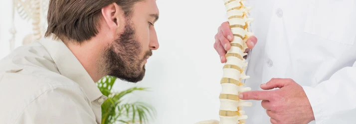 Chiropractic Pensacola FL Man Examining Spine