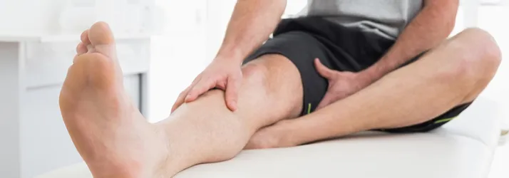 Chiropractic Pensacola FL Man Stretching Leg Chiropractic Pensacola FL Man Stretching Leg